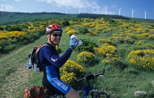 Cyclist reaching the top of Alto del Perdón