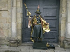 A person with a costume of the Apostol Santiago infron of the Cathedral