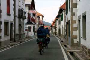 Pilgrims on the road by bicycle in Burguete 