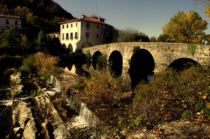 Passing through the bridge at the entrance of Villaba by bike